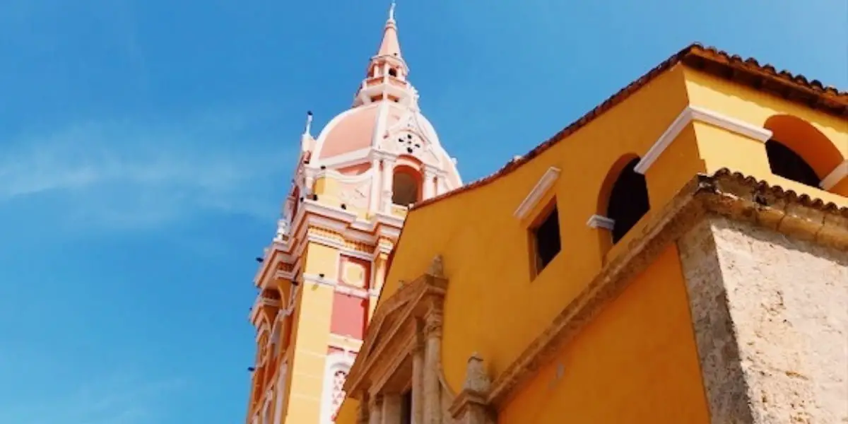 Yellow building against blue sky in Cartagena Colombia's Old City