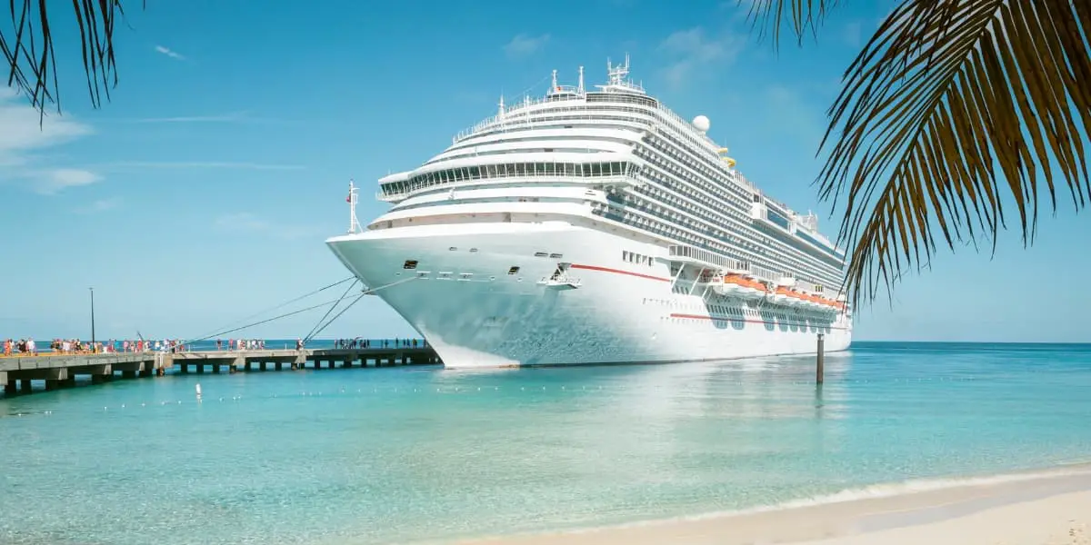 Cruise ship at port with palm trees